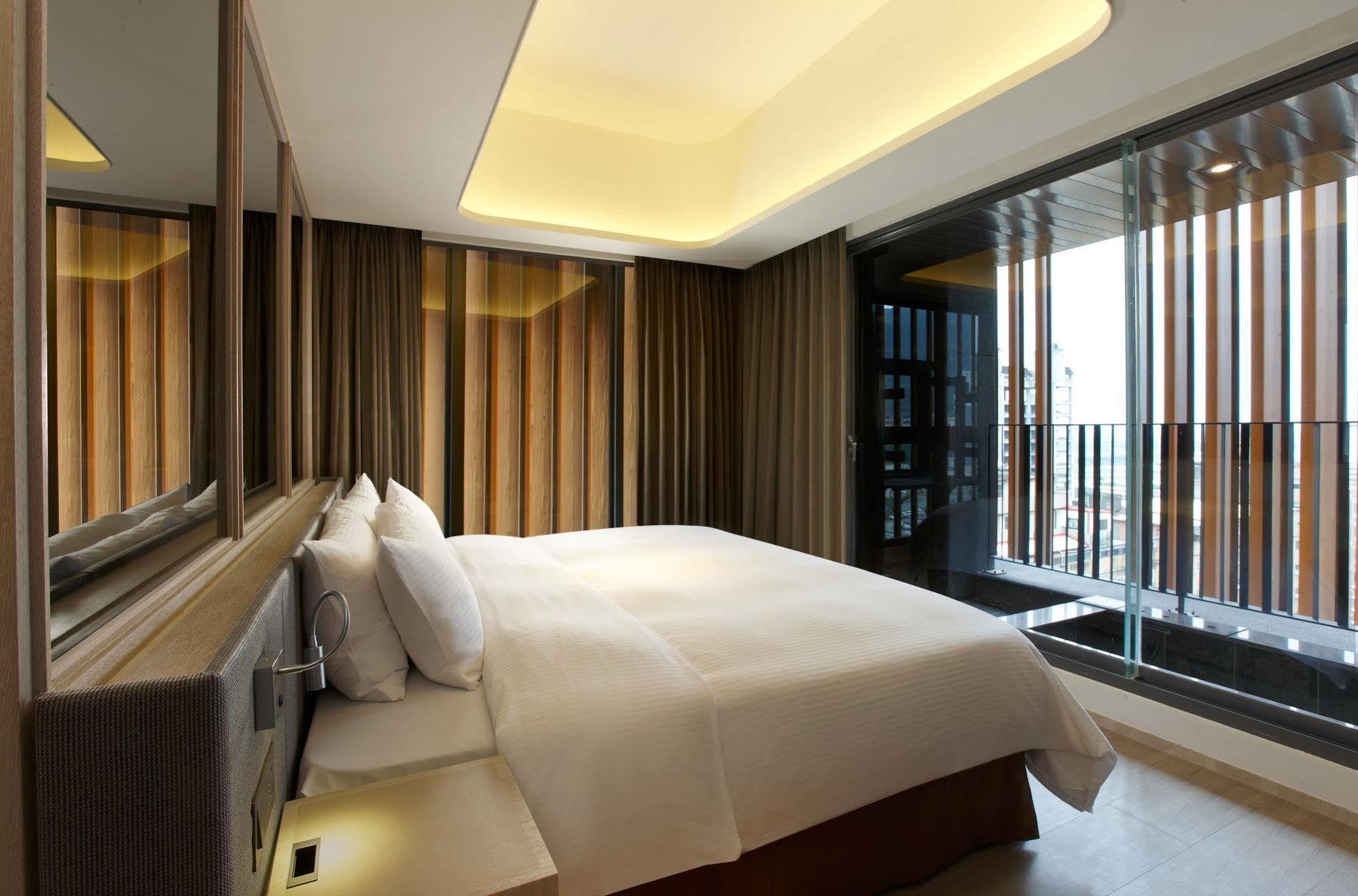 ホテル ウェルスプリング バイ シルクス 礁渓郷 エクステリア 写真 A bedroom at The Hari